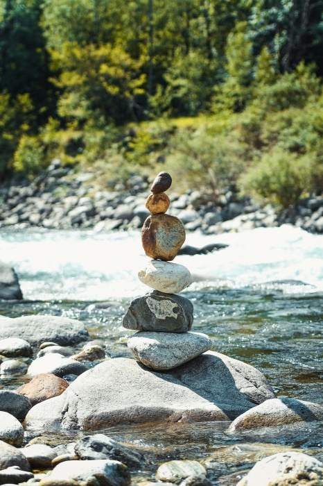 Construction of stacked stones on the banks of the Sesia in Valsesia