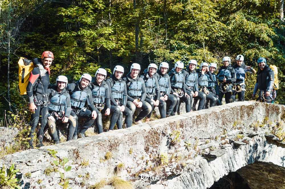 Canyoning group of Sesia Rafting on the Roman bridge of Piode in Valsesia.